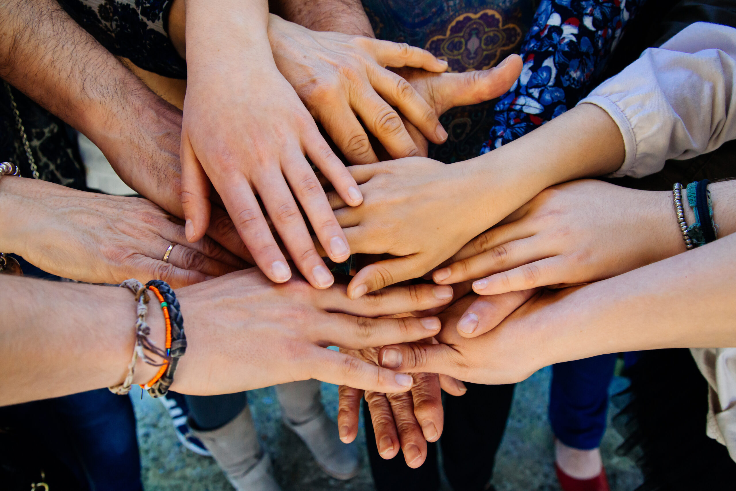 Multi generation family hands Multi generation family hands together on a heap